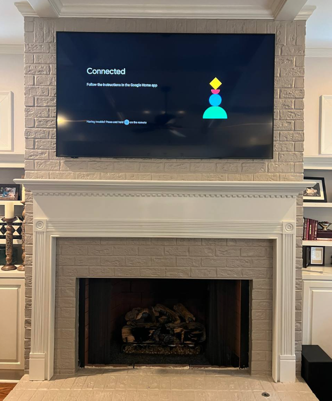 Fireplace TV mount install Atlanta, sleek hidden wires