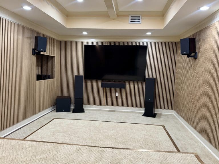 Home theater installation in Alpharetta with wall-mounted TV and surround sound system