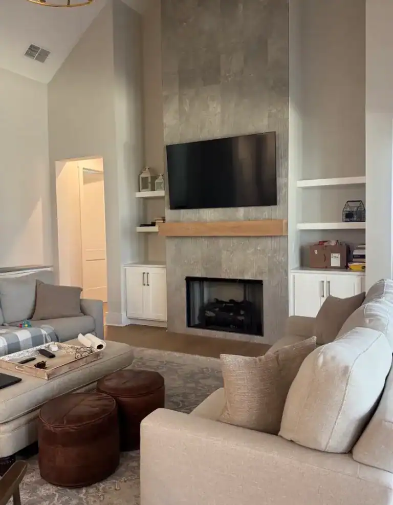TV installed above a fireplace with hidden wiring and flush wall mount in Atlanta