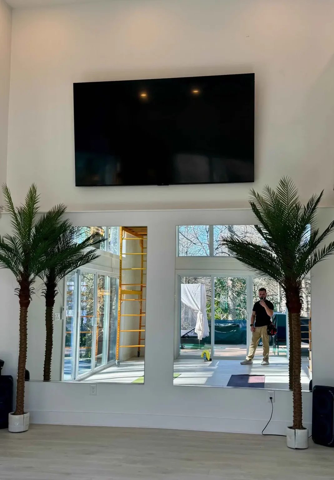 86 inch TV installed at 15 foot height on a high ceiling wall in Atlanta